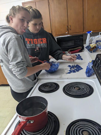 High School working hard on their gift to Veterans...chocolate covered pretzels!